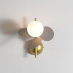 Grey version of this Clérachic wall light, three soft grey-brown discs around a glowing globe, with a brass stem and dome mount.