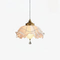 Clérachic ruffled pendant light on a plain white backdrop, lit softly, with beaded trim and a single crystal drop at the base.