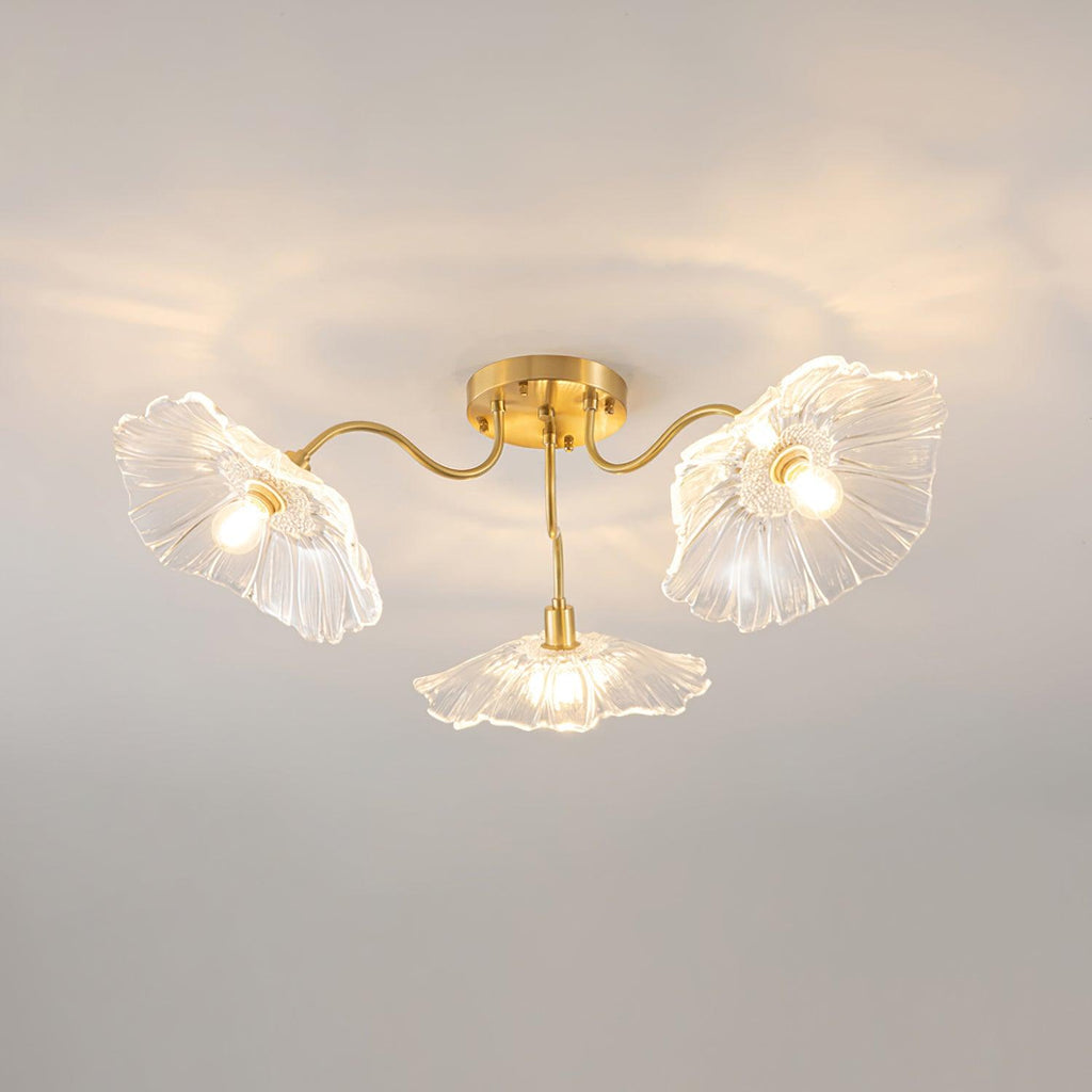 The Clérachic ruffled flower ceiling light in clear glass, three brass gooseneck arms fanning from a round canopy.