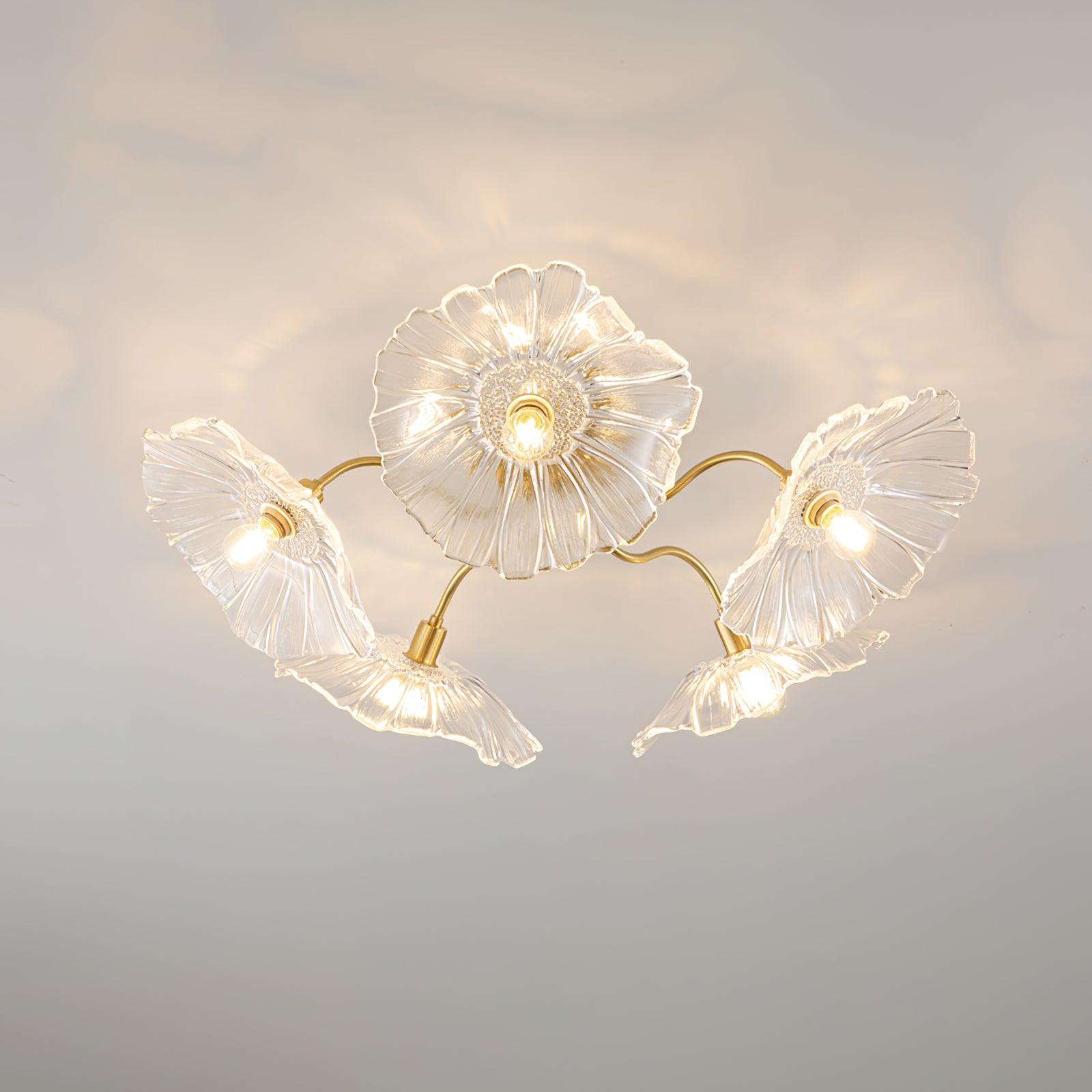 Five clear glass ruffled flowers on brass gooseneck arms make up this Clérachic ceiling light, each shade lit from within.