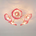 This Clérachic ceiling light shows five pink ruffled glass flowers, each shading a bulb on its own brass arm.