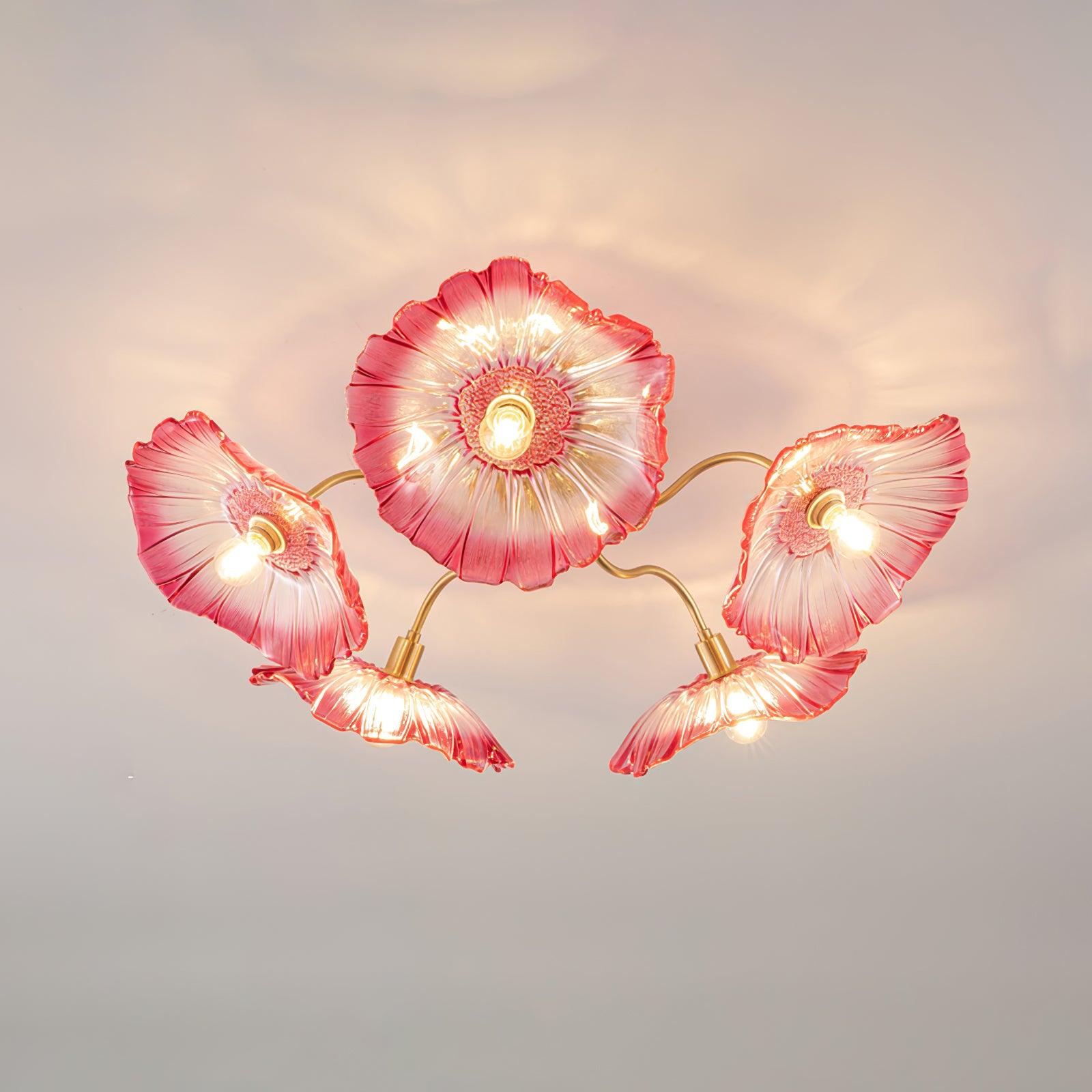 This Clérachic ceiling light shows five pink ruffled glass flowers, each shading a bulb on its own brass arm.