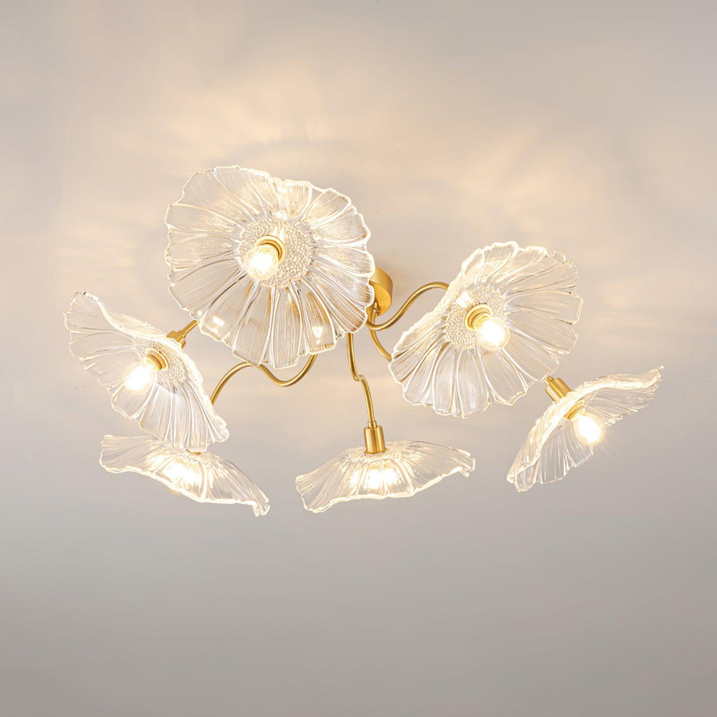 Clérachic's ceiling light in clear glass, its pressed flower shades angled up, down and outward from a brass canopy.