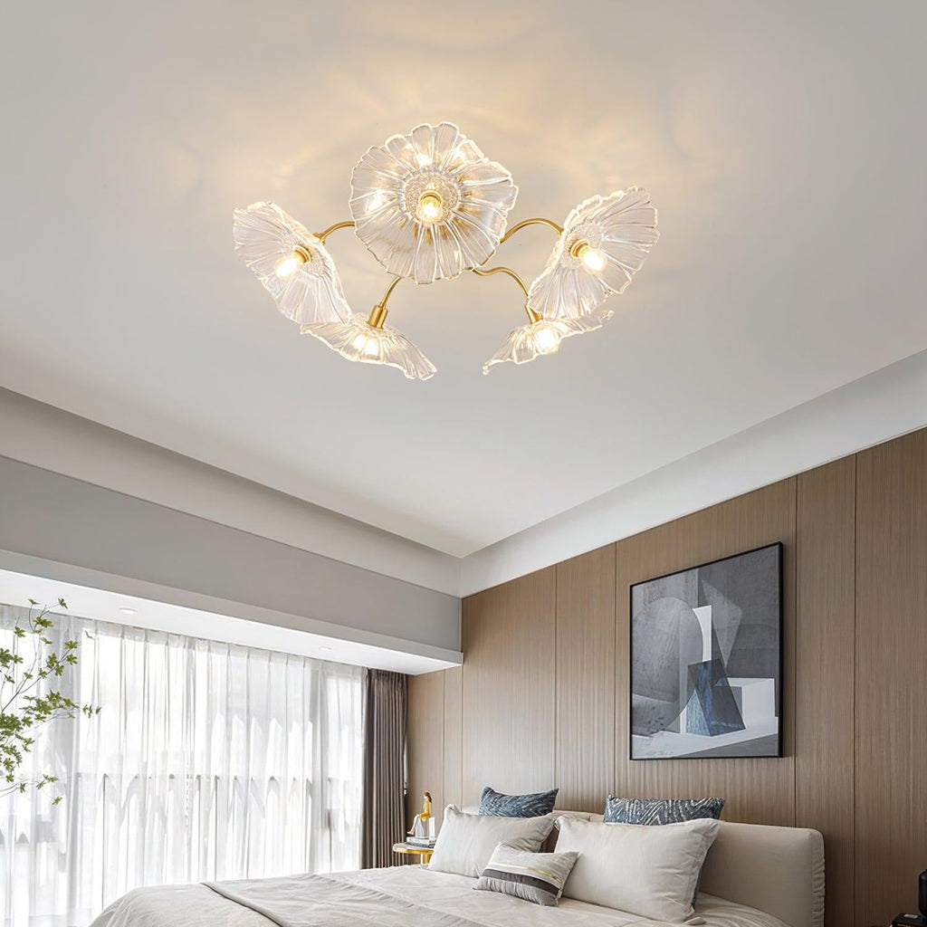 Clérachic's clear glass ceiling light hangs over a bed in a wood-panelled bedroom with a dark abstract print.