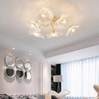 Clérachic's clear glass ceiling light hangs beneath a honeycomb of hexagonal mirrors in a bright living room.
