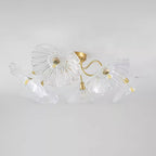 Studio shot of the Clérachic clear glass ceiling light, its ruffled shades spread wide against a grey backdrop.