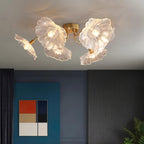 This Clérachic ceiling light in clear glass lights a moody navy living room hung with colour-block art.