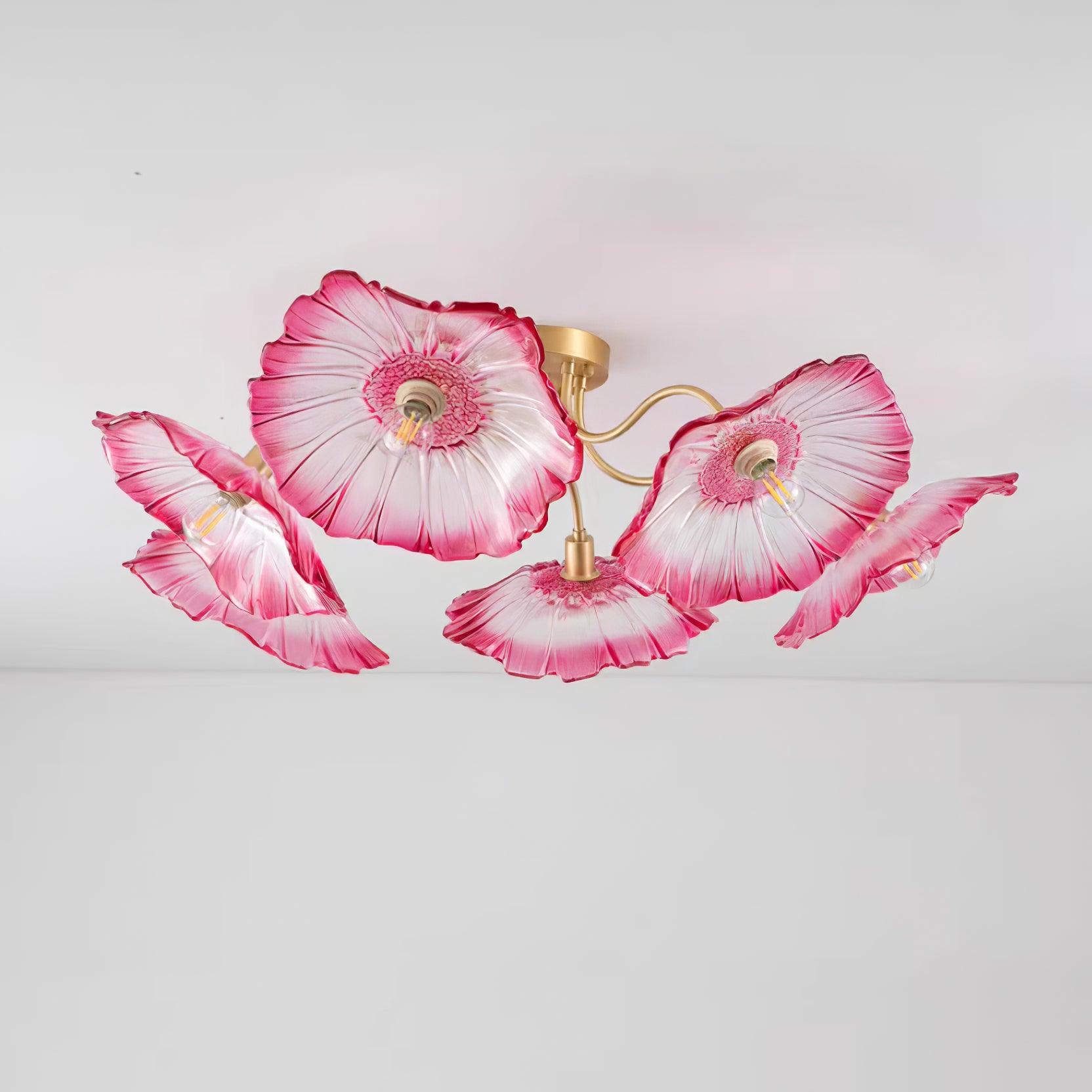 Studio shot of the Clérachic pink glass ceiling light isolated on white, its five ruffled shades fully lit.