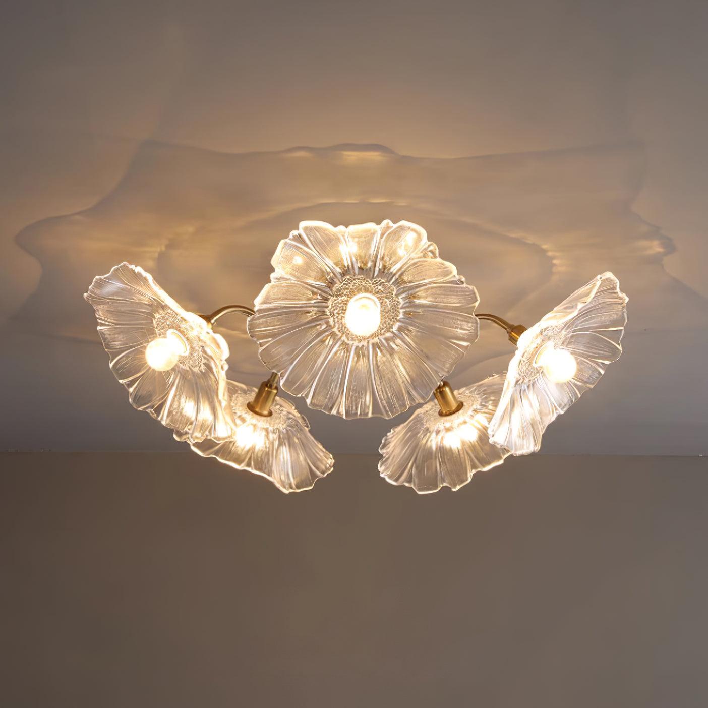 A dramatically lit clear glass Clérachic ceiling light casts a soft shadow across the ceiling above it.