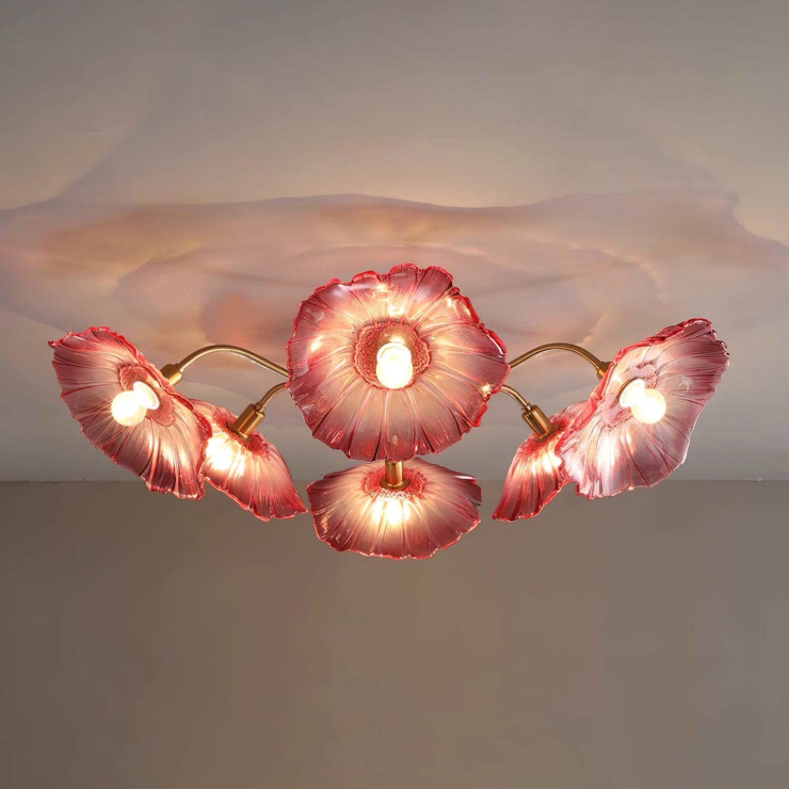 The pink glass version of Clérachic's ceiling light, dramatically lit with its shadow spreading across the ceiling.