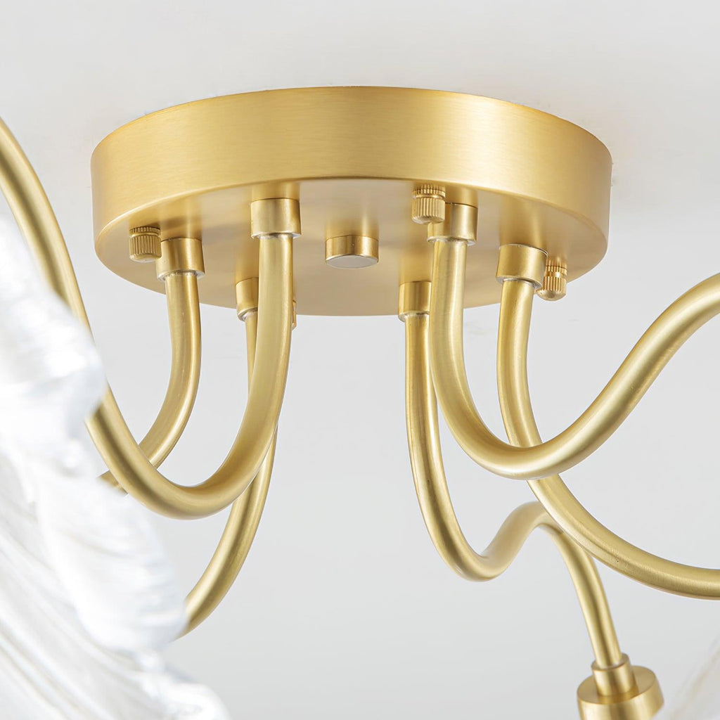 Close-up of the brass ceiling canopy on the Clérachic ruffled flower light, its gooseneck arms fanning out underneath.