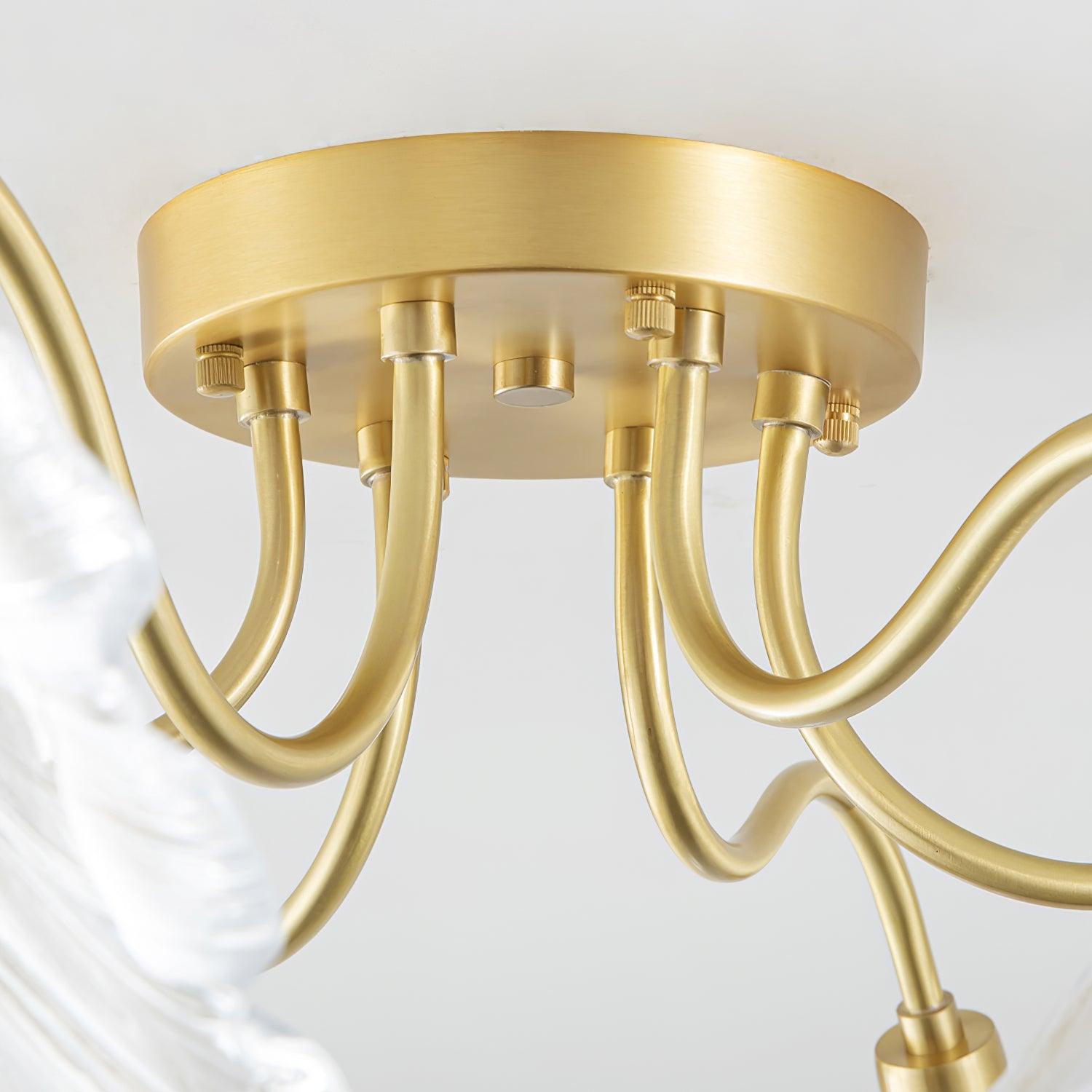 Close-up of the brass ceiling canopy on the Clérachic ruffled flower light, its gooseneck arms fanning out underneath.