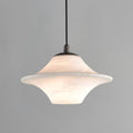 Clérachic saucer pendant, a wide low-profile alabaster shade on a black cord against grey.