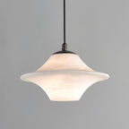 Clérachic saucer pendant, a wide low-profile alabaster shade on a black cord against grey.