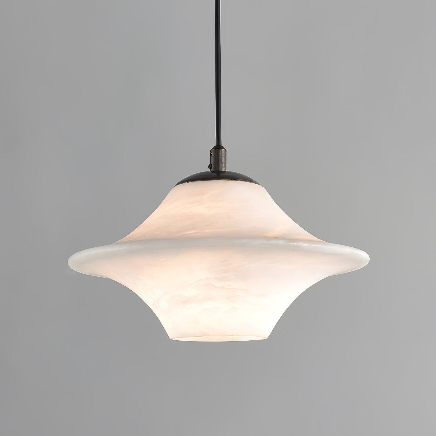 Clérachic saucer pendant, a wide low-profile alabaster shade on a black cord against grey.