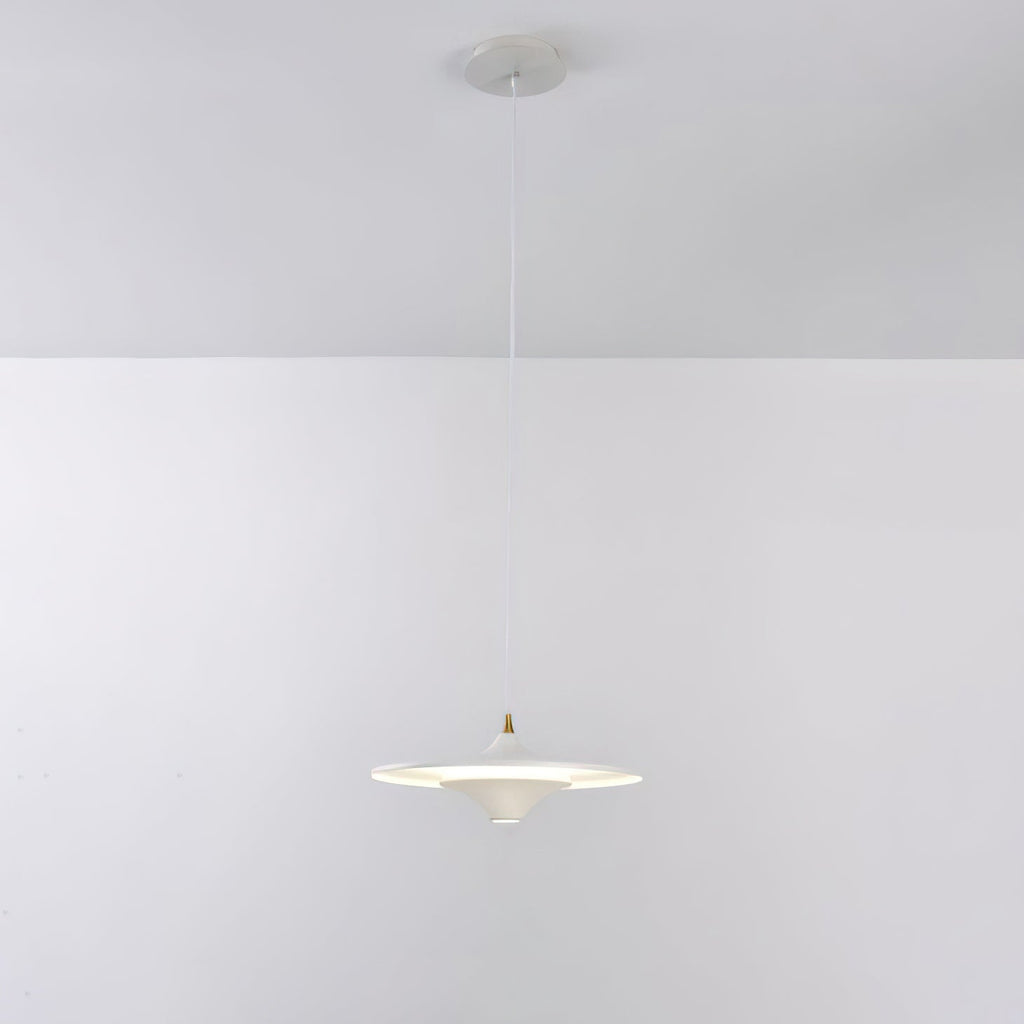 White Clérachic saucer pendant on a thin white cord from a white ceiling canopy, glowing softly against a grey wall.