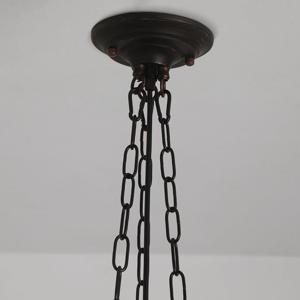 Detail of the Clérachic scalloped glass dome pendant light canopy — a domed, lightly distressed bronze-black plate with three chains