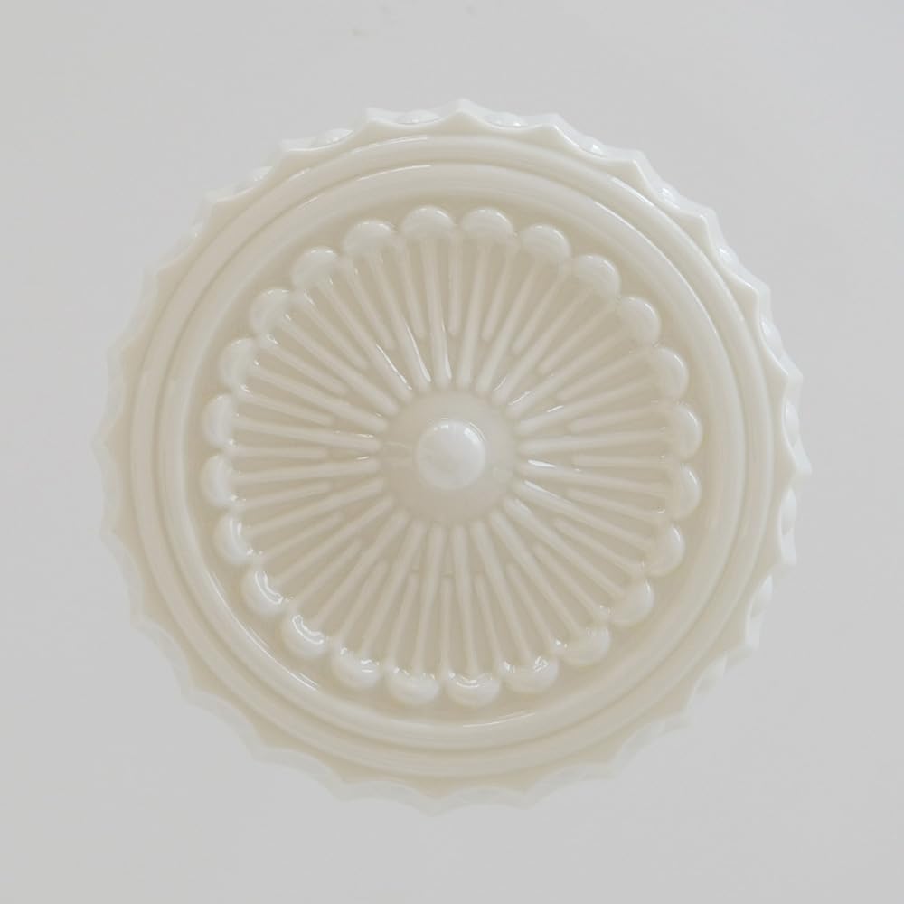 Straight-on underside of the white Clérachic scalloped glass dome pendant light, showing the pressed bead-and-ray rosette