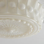 Underside detail of the Clérachic scalloped glass dome pendant light in milk-white glass, rosette centre and scalloped edge