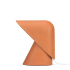Large front view of this Clérachic table lamp in orange, showing the cone base, folded shade and white cord on a white backdrop.