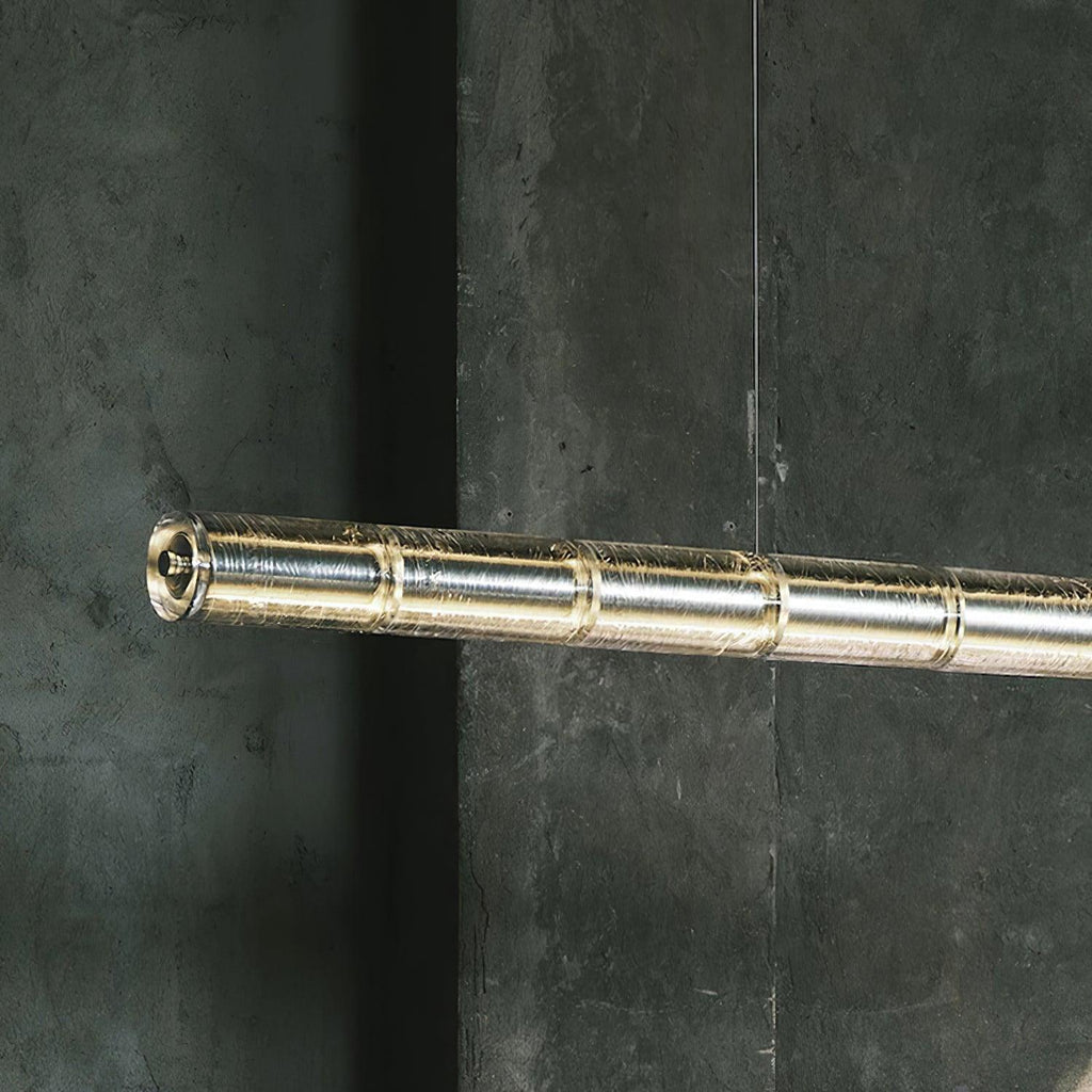 Close view of the end of this Clérachic chandelier, showing the ribbed clear glass segments joined along a lit tube.