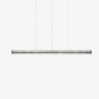 Unlit clear glass linear chandelier from Clérachic with chrome end caps, shown straight-on against a light grey studio backdrop.