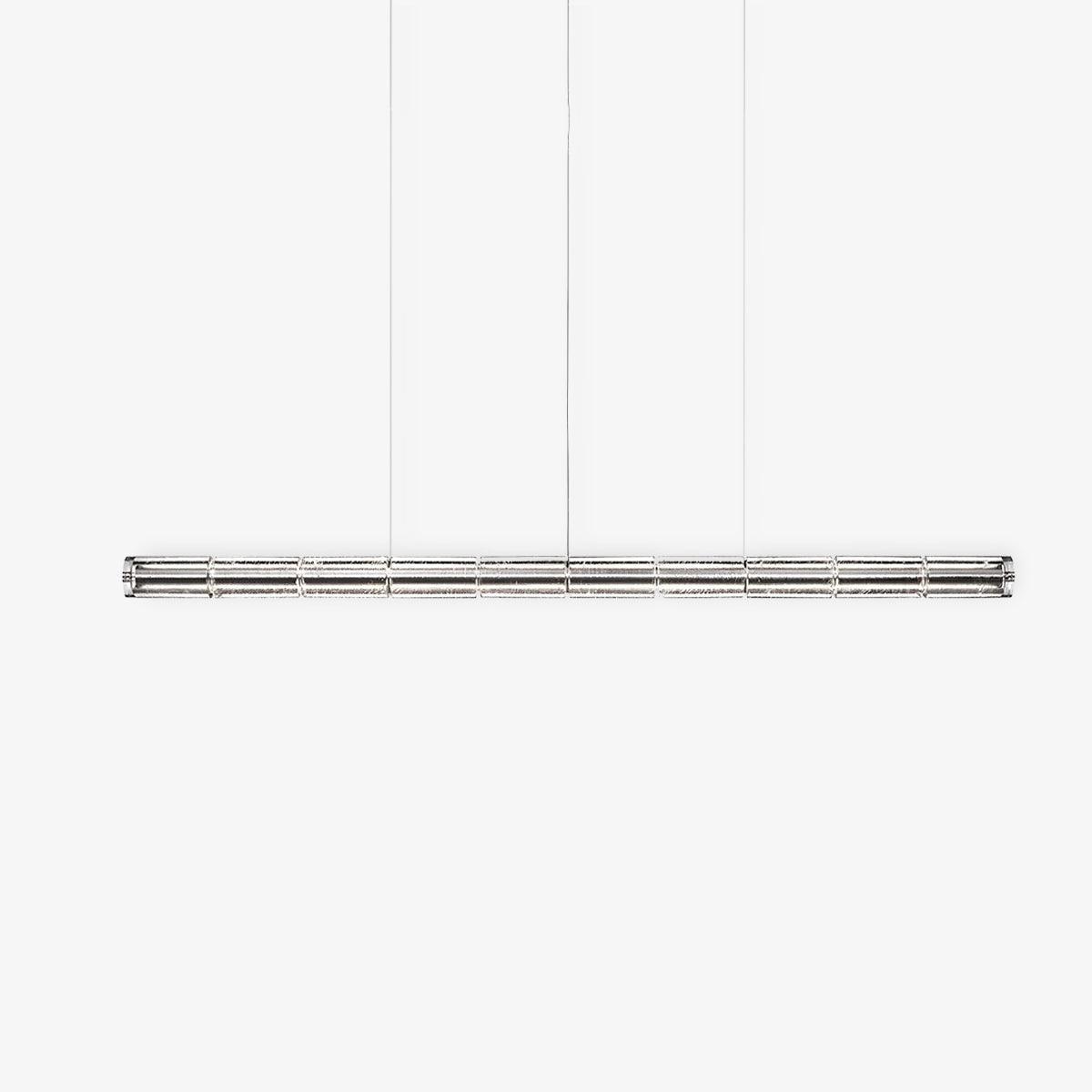 Unlit clear glass linear chandelier from Clérachic with chrome end caps, shown straight-on against a light grey studio backdrop.