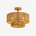 Product view of this Clérachic light's open hemp rope weave in gold hardware, its bulbs glowing through the rope tiers.