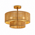 Straight-on product view of this Clérachic light's gold hardware and open hemp rope weave, bulbs glowing within.