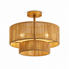 Straight-on product view of this Clérachic light's gold hardware and open hemp rope weave, bulbs glowing within.