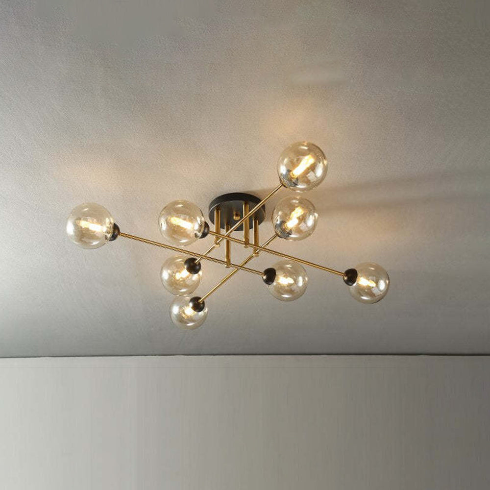 Eight cognac globes warm the room on this Clérachic sputnik chandelier, arms fanning out from a compact black canopy.