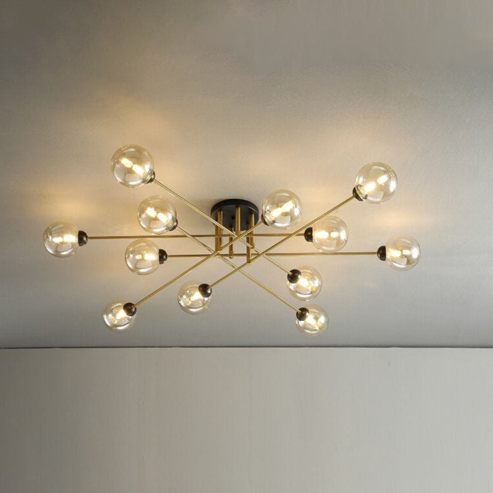 Twelve cognac globes span the ceiling on the Clérachic sputnik chandelier, honey-toned glass over slim brushed-gold rods.