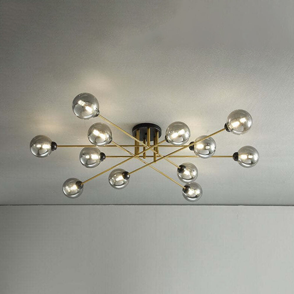 The twelve-light Clérachic sputnik chandelier in grey smoked glass, its widest span reaching right across a living-room ceiling.