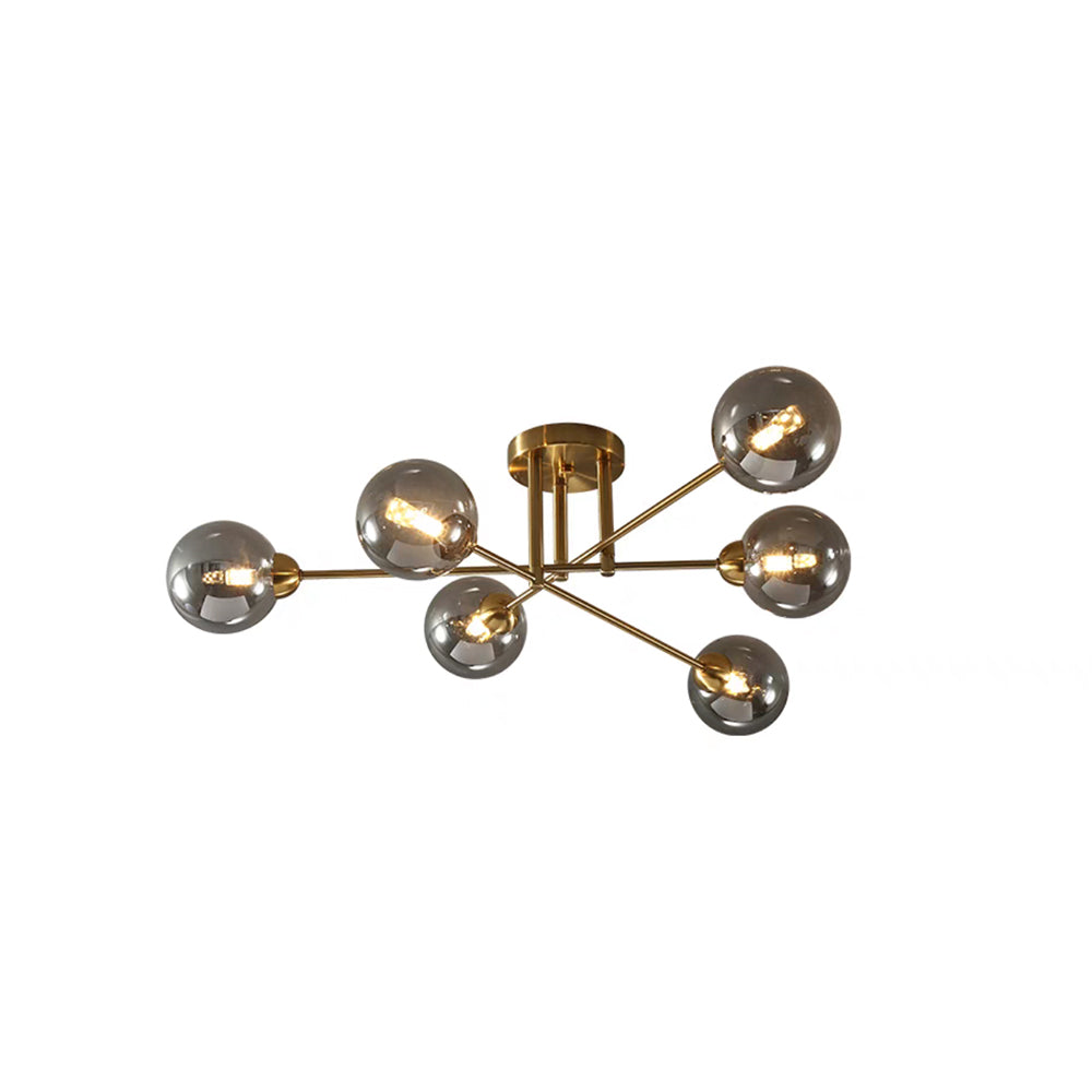 Clérachic sputnik chandelier cut out on white, six grey smoked globes lit on gold rods from a round gold canopy.