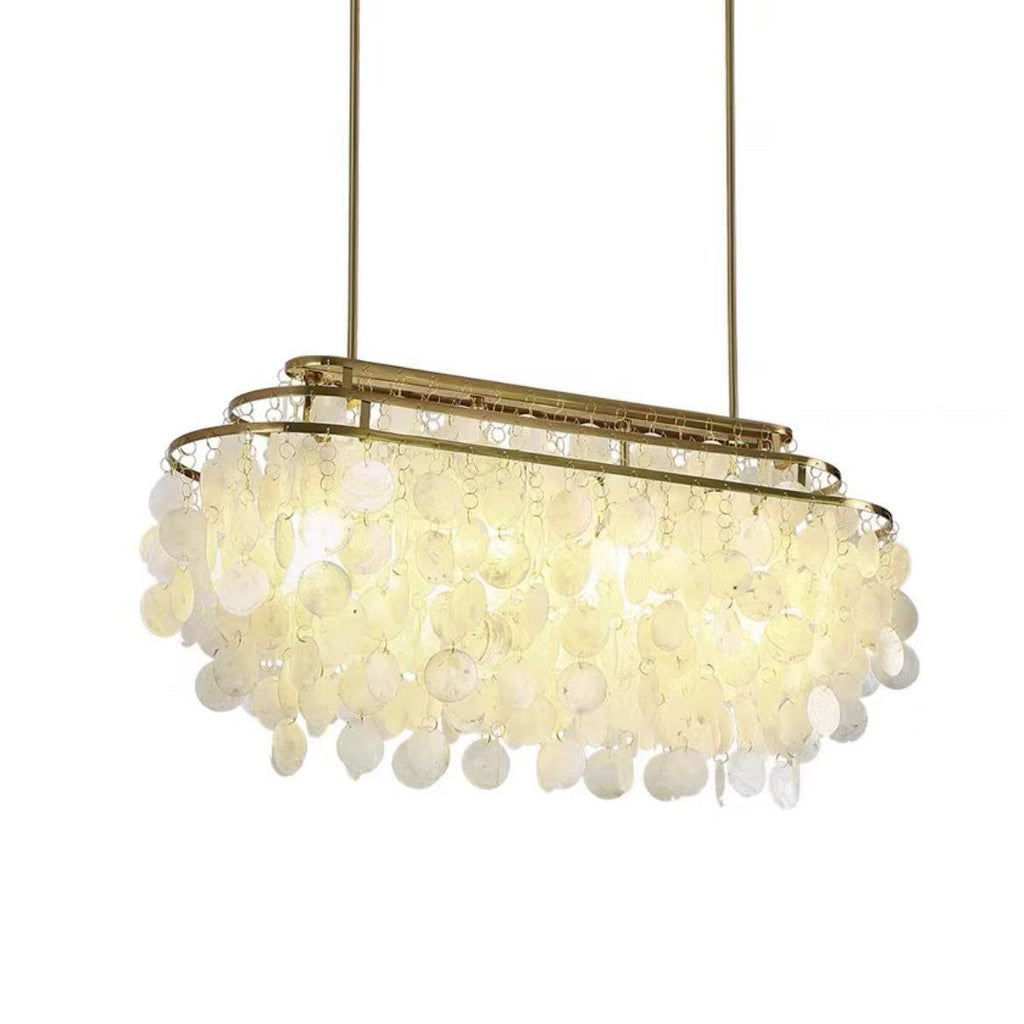 Long oval Clérachic shell chandelier on two gold rods, lit warm, with its discs hanging below the oval frame.