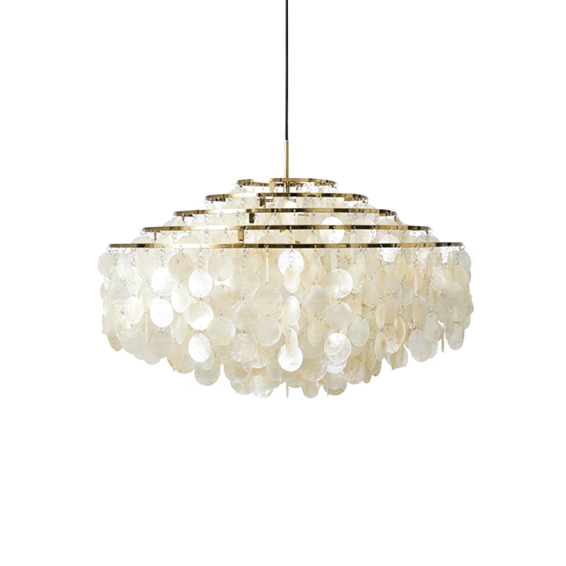 Gold-ringed Clérachic shell chandelier on white, with stepped rings and a broad, squared spread of shell discs.