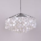 Wide chrome-ringed Clérachic shell chandelier, unlit, with full rows of white discs, hung from a slim chrome stem.