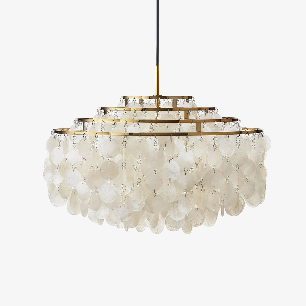 Gold-ringed shell disc chandelier from Clérachic on a plain white backdrop, tiers of white discs hanging below a stepped frame.