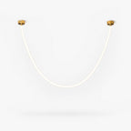 This Clérachic pendant light on a plain white backdrop, a slim glowing silicone tube curving in a deep U between two small gold ceiling plates.