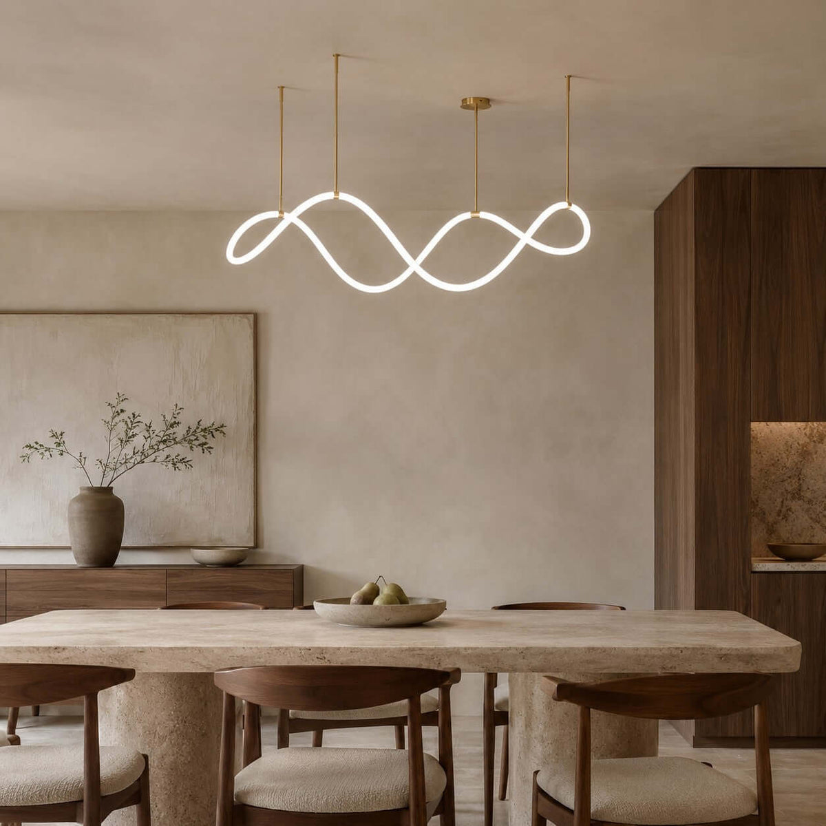 Clérachic wave pendant lit above a rough-stone dining table and walnut chairs, with a large soft painting and a dark wood cabinet.
