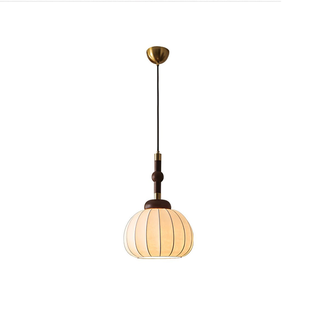 Clérachic silk globe pendant lamp in the gold colourway, its rounded ribbed shade and gold collars seen against a plain background.