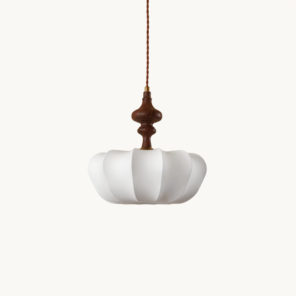 This Clérachic silk pendant with a turned walnut-colour wooden top, shown on a plain white backdrop and hung from a twisted cord.