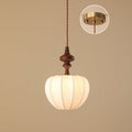 Clérachic pendant with a plain turned wooden top and a rounded white shade, with the brass canopy shown in a circle inset.