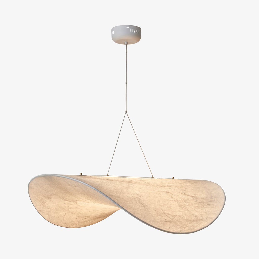 A large twisted white pendant seen from slightly below, hanging from a round white canopy against a pale grey backdrop, from Clérachic.