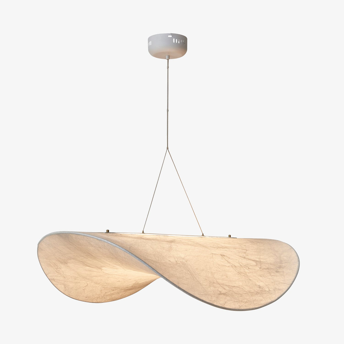 A large twisted white pendant seen from slightly below, hanging from a round white canopy against a pale grey backdrop, from Clérachic.