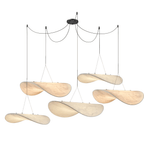 Five twisted white pendants in several sizes hang from looped black cables on one black ceiling canopy, a Clérachic cluster.