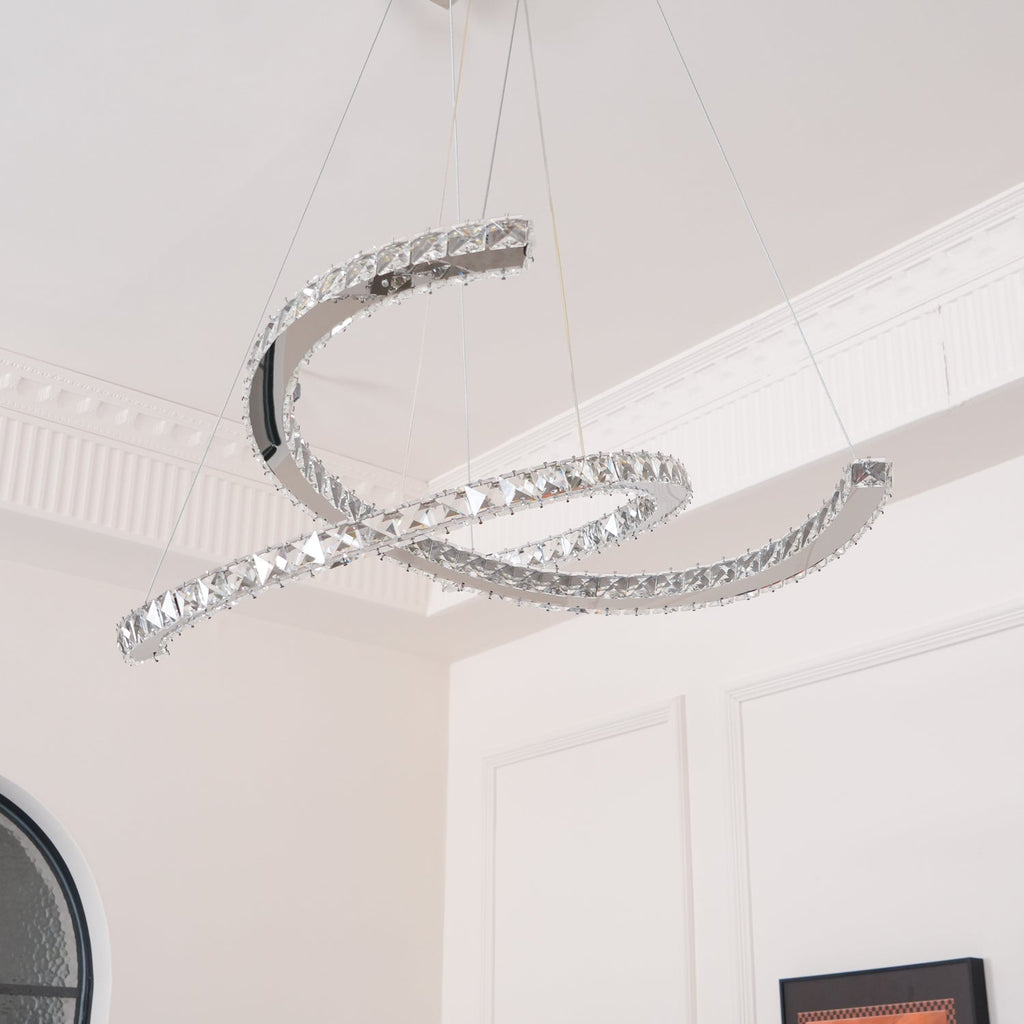 Clérachic pendant seen from an upward angle under a corniced ceiling, its crystal-set crescents unlit.