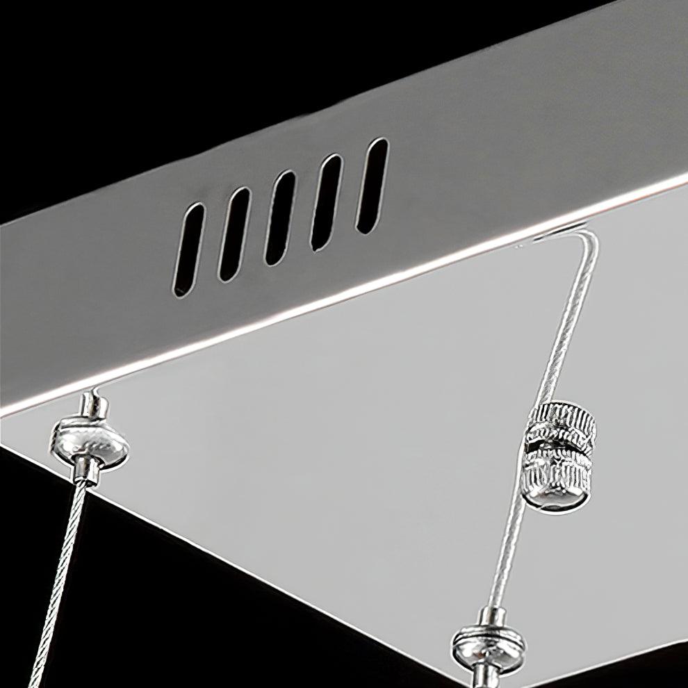 Close view of the steel ceiling plate of this Clérachic pendant, with its vent slots and cable grippers.