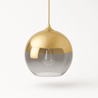 Clérachic champagne glass sphere pendant on a white backdrop, brass rod tapering into the gradient glass shade.