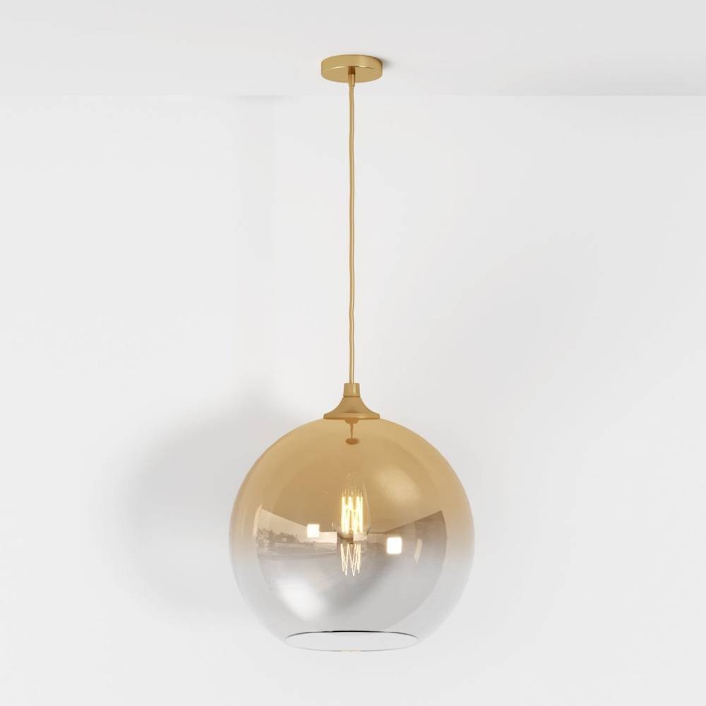 Clérachic champagne-finish pendant hangs full length from ceiling canopy to glass sphere on a plain white ground.